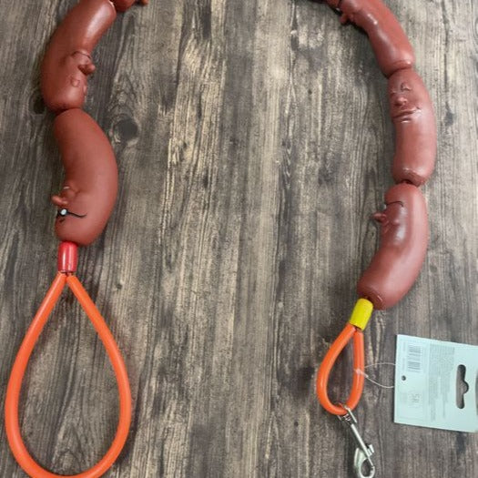 Dog Hand Holding Rope A Bunch Of Big Sausage